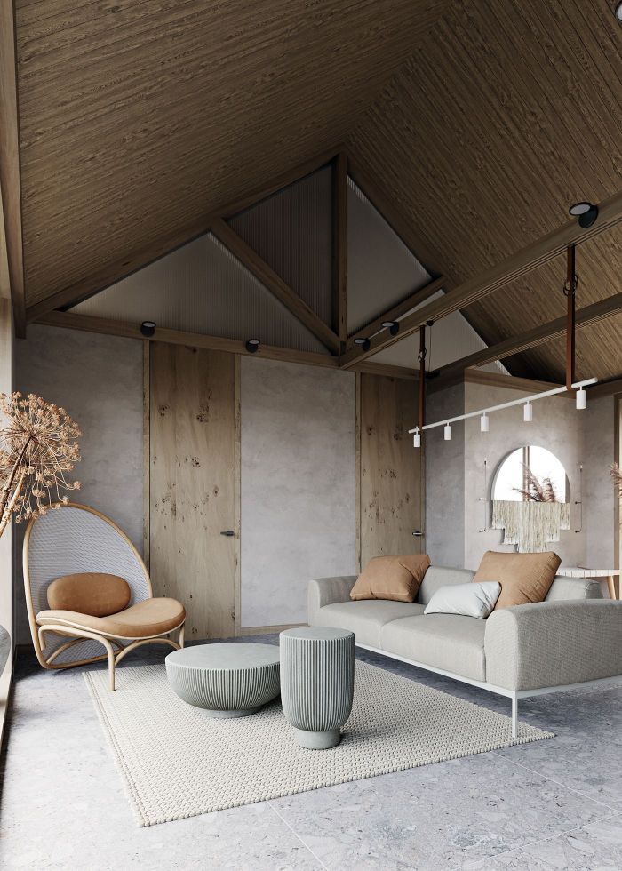 exemple deco salon zen et chaleureux canapé gris chaise marron table grise sut tapis tressé poutres apparentes charpente bois