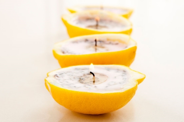 fabriquer bougie bricolage facile zeste de citron rempli de cire végétale herbes mèche cire