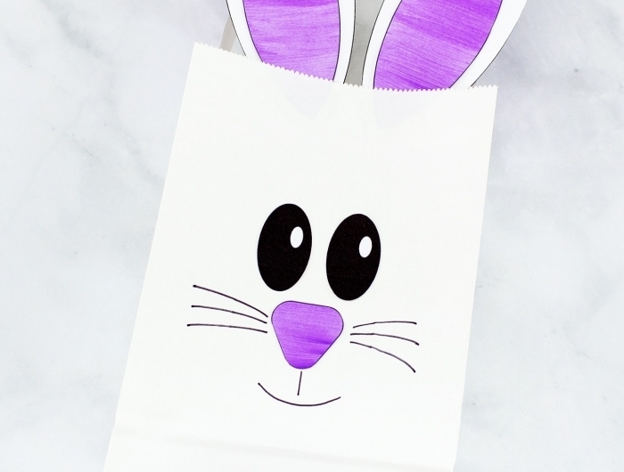 décoration de paques à fabriquer avec les enfants diy sac pochette en papier blanc dessin visage moustache lapin