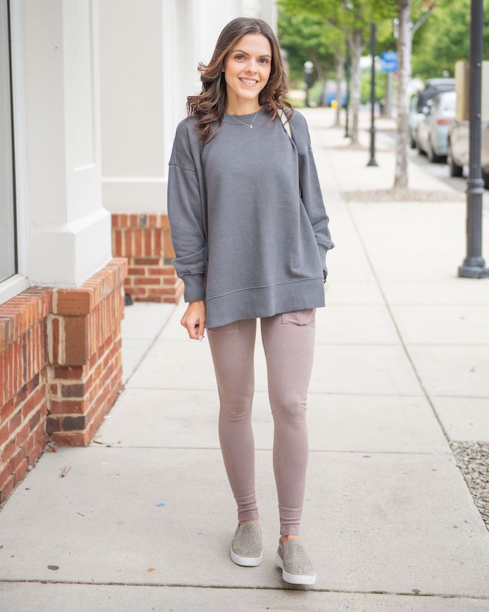go for a streetwear look for women with yoga pants and a gray knit sweater