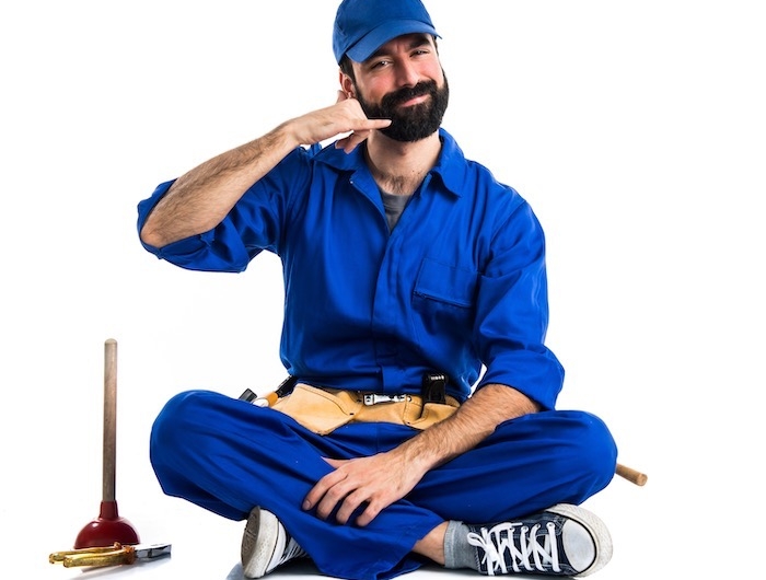 plumber making phone gesture