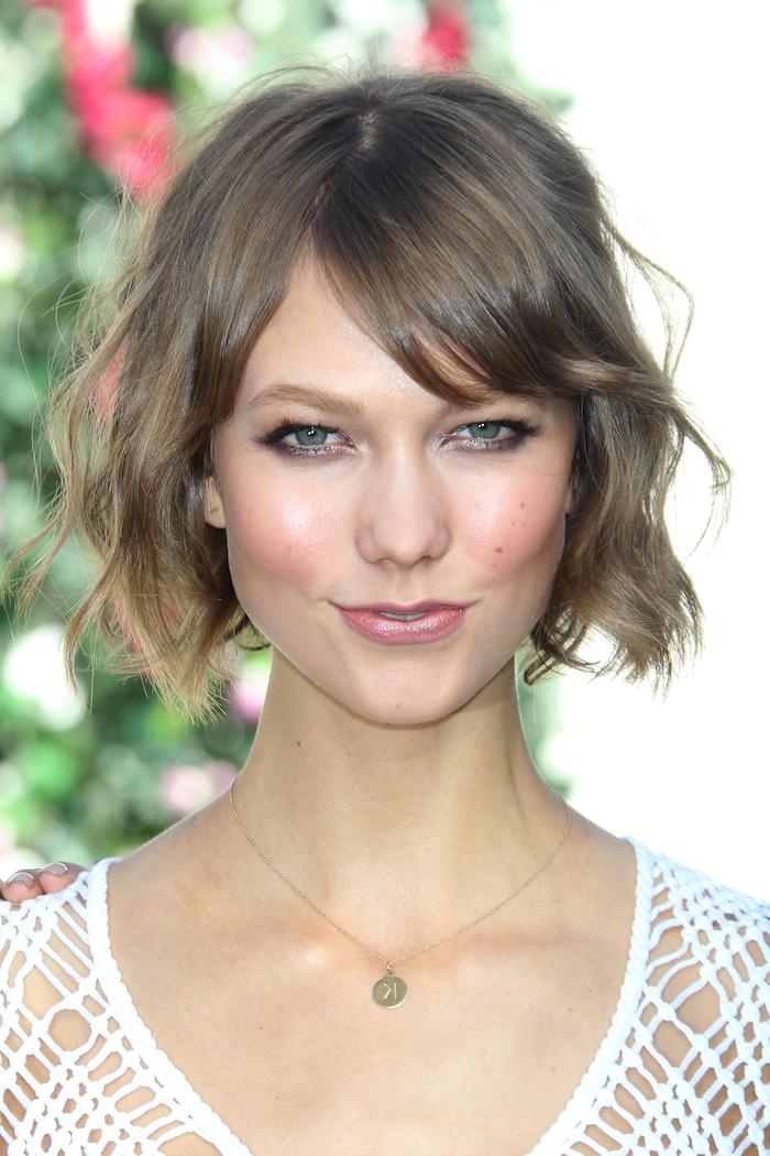 Soft and scattered short haircut with bangs curtain woman in white top