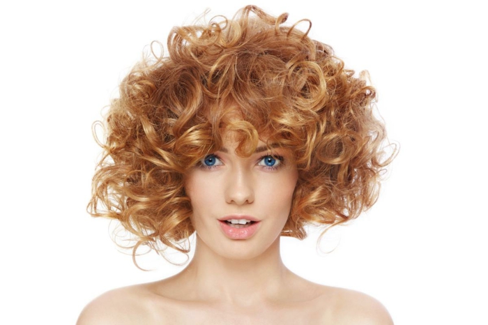 Short curly haircut for a lady with red hair and blue eyes for the second size