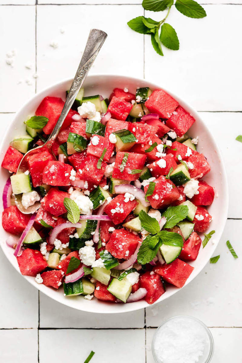 Fresh fruit salad and summer vegetables with watermelon onion cucumber