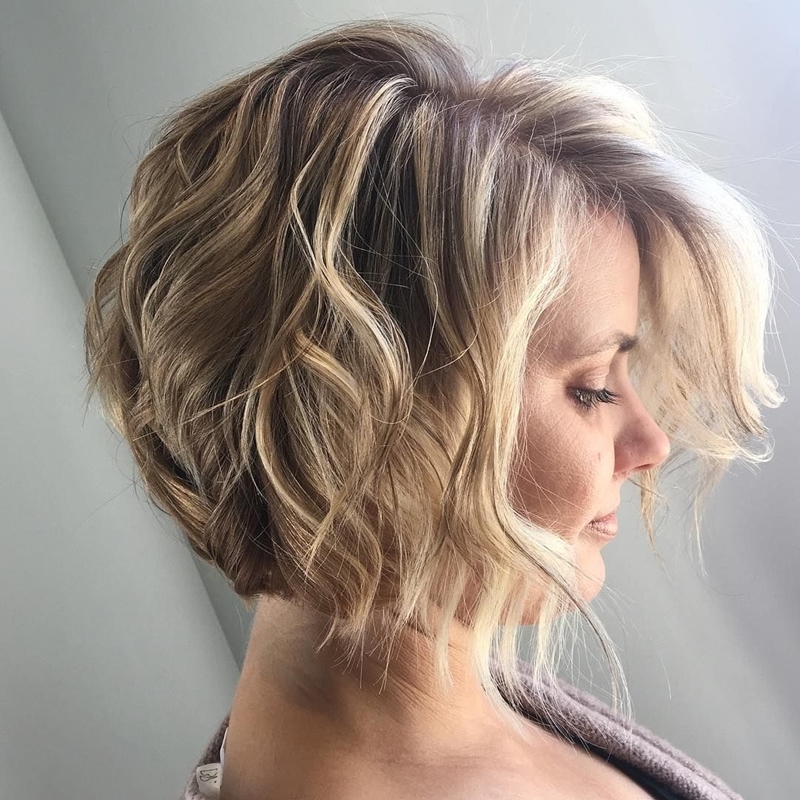 Distressed short haircut square blonde woman accentuating dark curls and roots