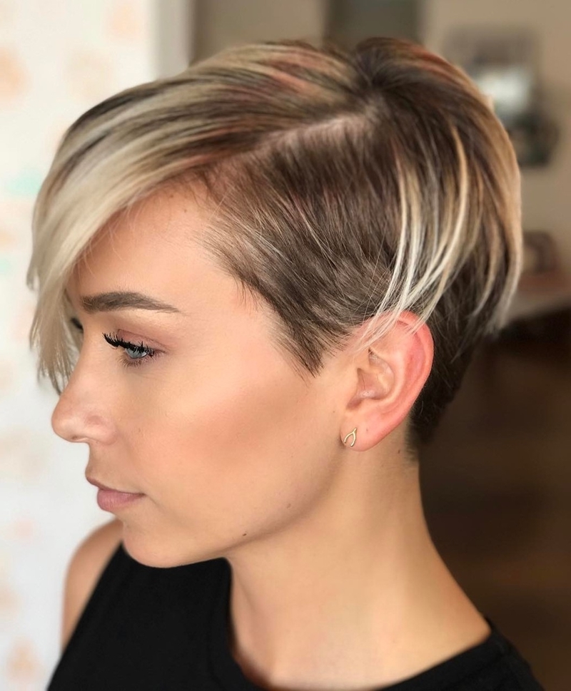 Short haircut woman highlights ash blond coloring trend
