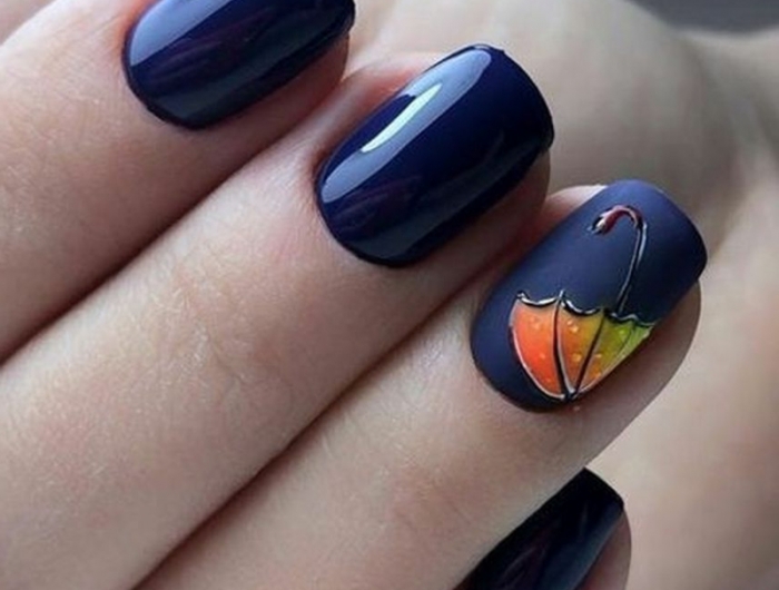 nail art automne parapluie orange sur les ongles blue foncé