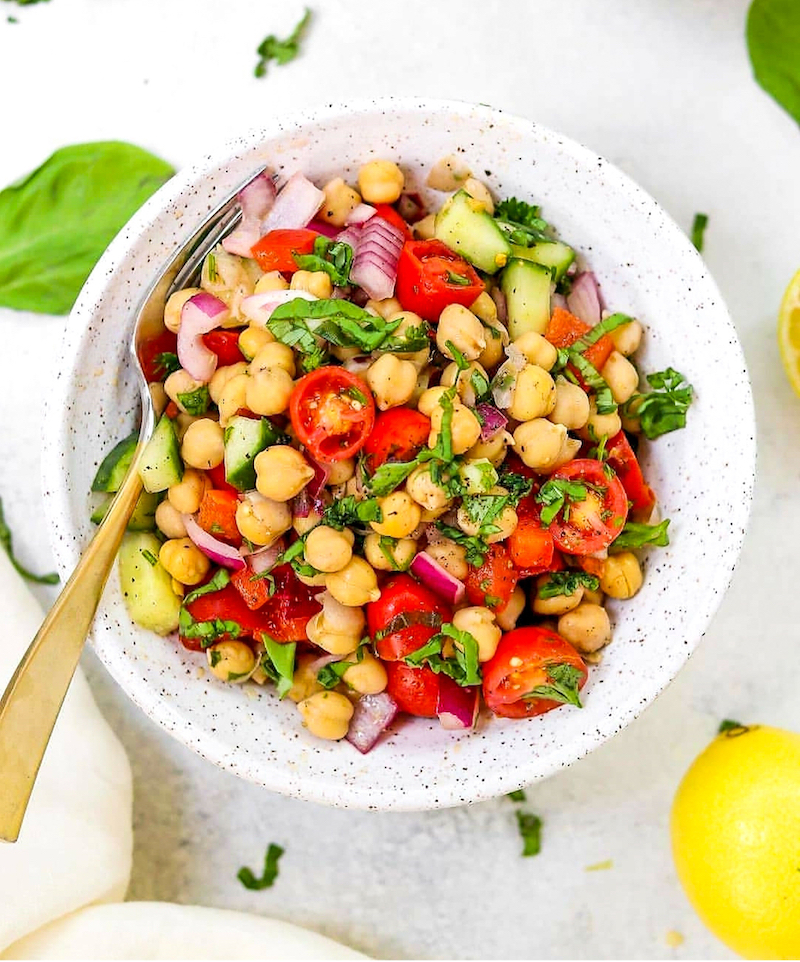 chickpeas with cumin in a salad with tomatoes and cucumbers