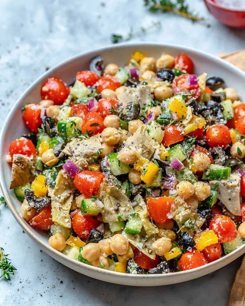 Chickpeas with cumin in a salad with tomatoes, cucumbers and peppers