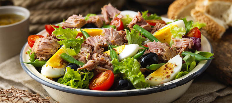 tuna salad with eggs tomatoes olives green salad