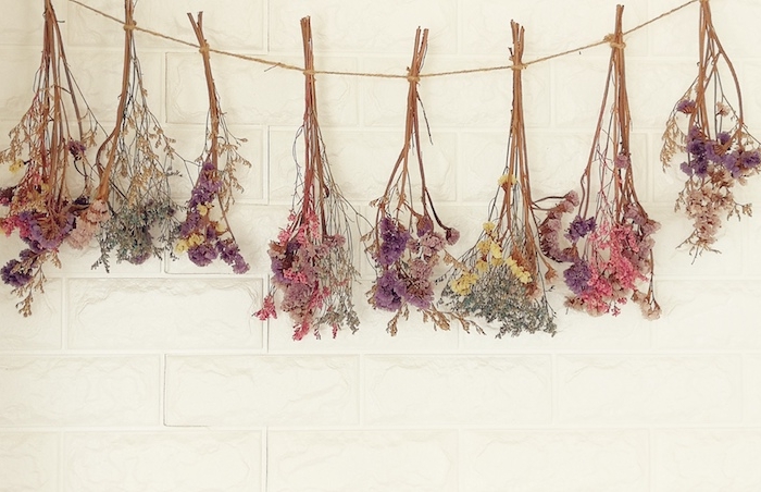 dried flowers hanging on the wall.it decoration wall of living room