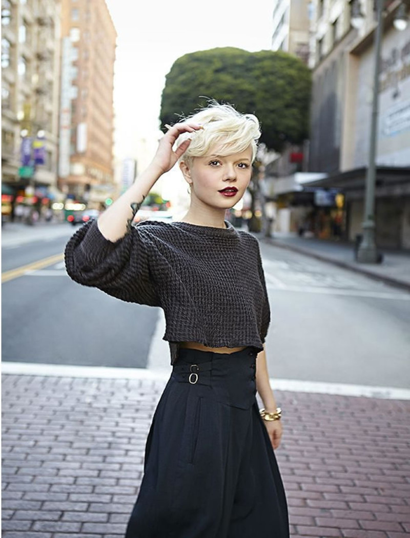 Natural blonde short curly bob with bangs black outfit