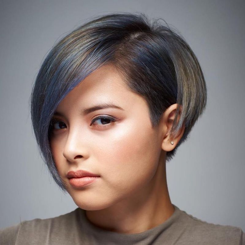 Blonde and blue highlights on dark brown short hair trendy women's bixie square cut