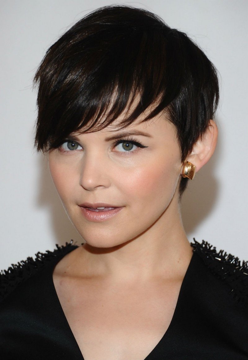 Soft round face pixie haircut with asymmetrical bangs on the side of the face
