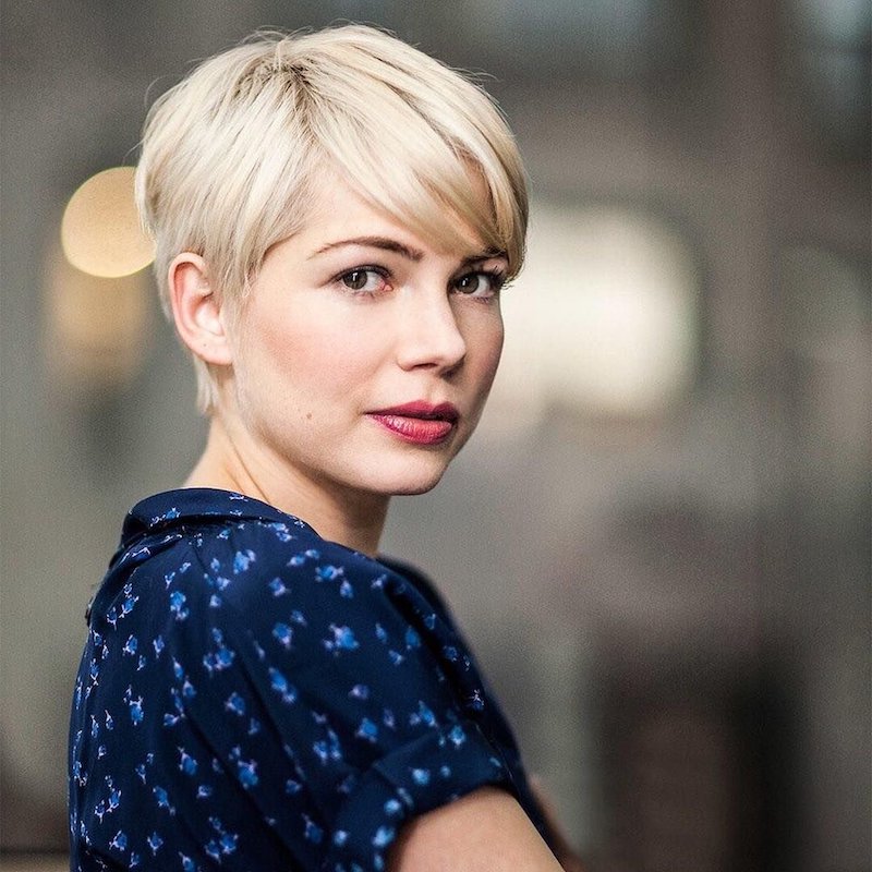 Classic soft blond haircut model with asymmetrical bangs