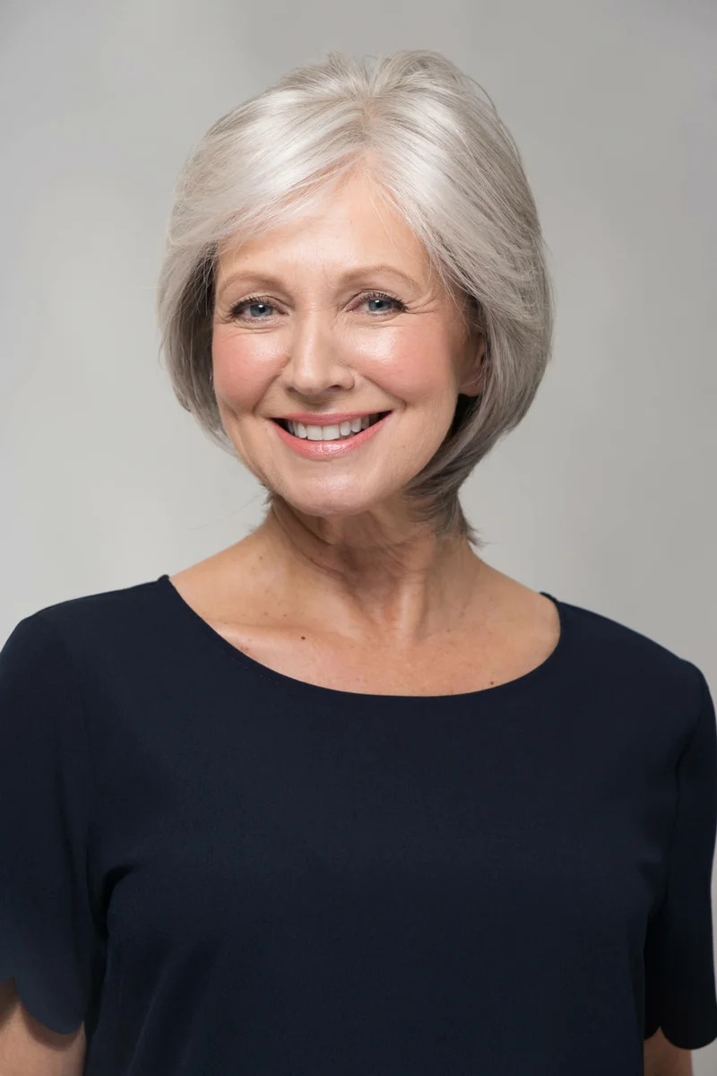 A woman with a 60-year-old gray haircut of various lengths