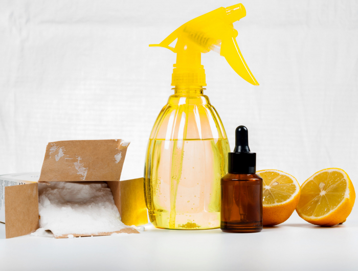 eco friendly natural cleaners made of lemon and baking soda on white wooden table