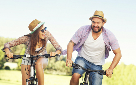 romantic couple riding bikes