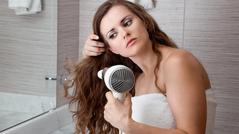How does a woman grow hair with a hair dryer