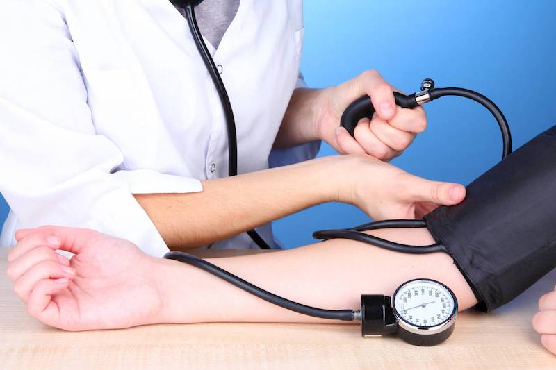 blood pressure measuring on blue background
