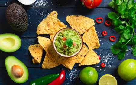 guacamole with ingredients and tortilla chips