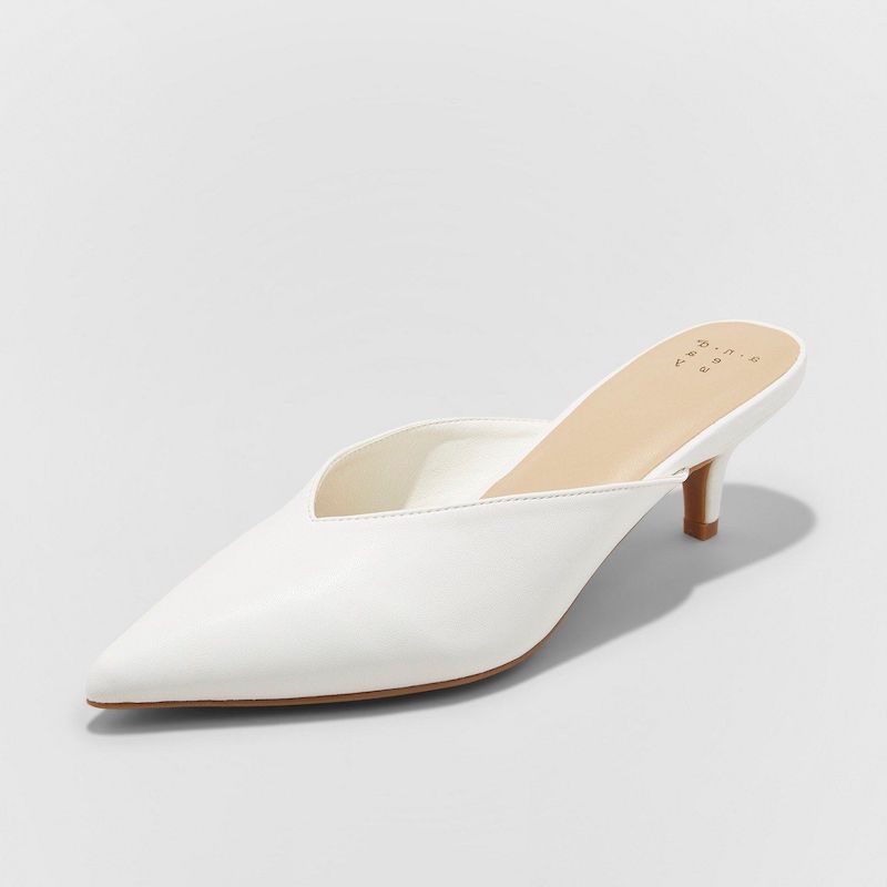white mules closed at the front with small heel