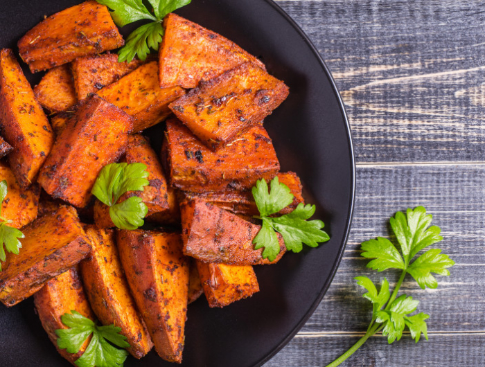 homemade cooked sweet potato with spices and herbs.