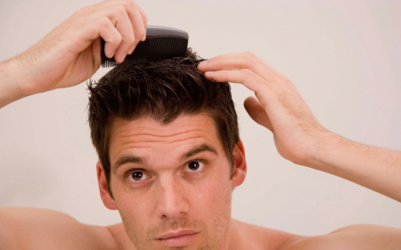 man combing his hair