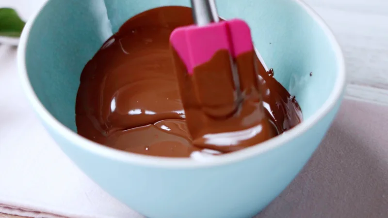 melted chocolate pink spatula turquoise bowl preparation homemade bars
