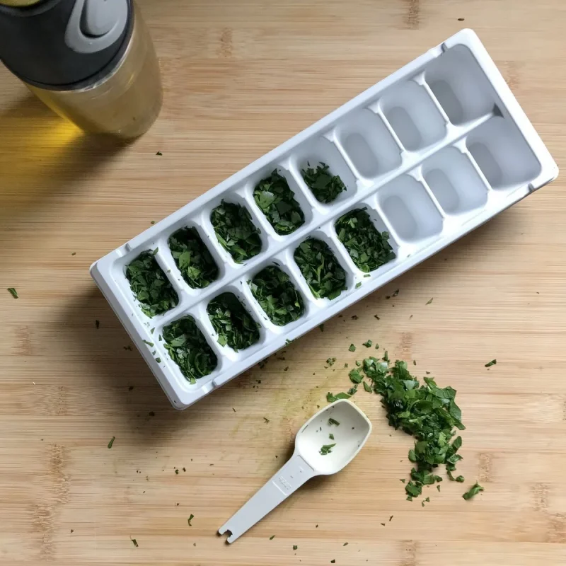 chopped parsley cube preservation in the freezer spoon olive oil