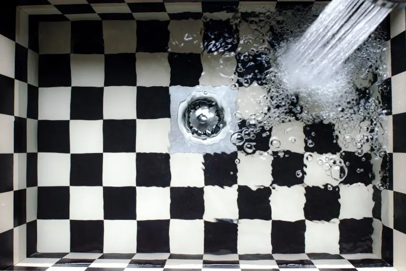 Black and white tile odors drain for running water