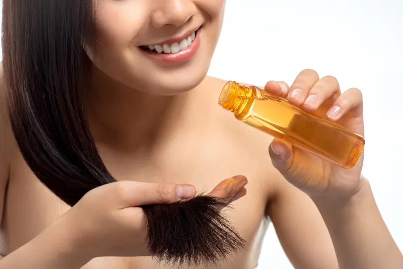 What oils should be used on hair to stimulate growth