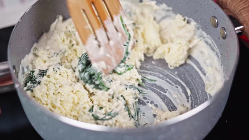 Stir in cheese and already cooked spinach