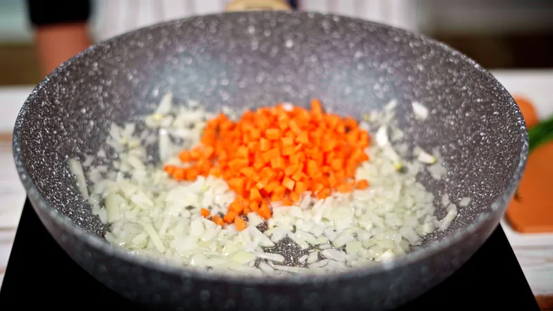 Fried rice with carrots, pepper and sesame