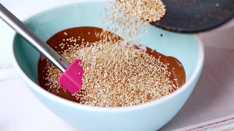 pink spatula blue bowl quinoa chocolate bar recipe