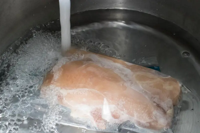 thaw chicken breast quickly in a bowl of cold water
