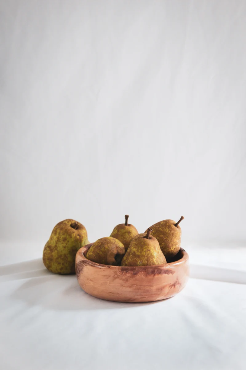 pears in a wooden cup