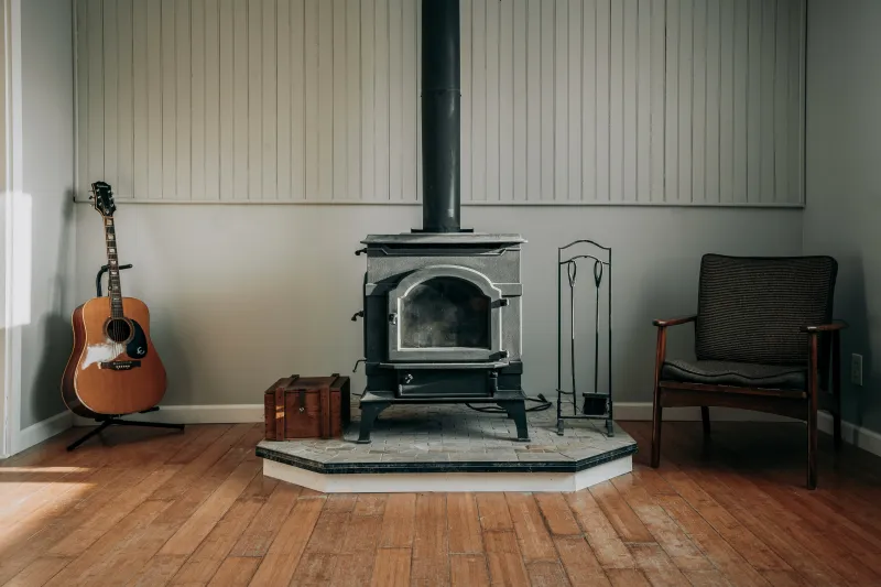 wall covering wood floor wood stove guitar wood chair