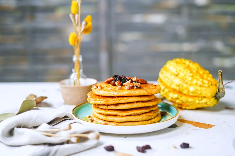 Table with pumpkin breakfast pancakes