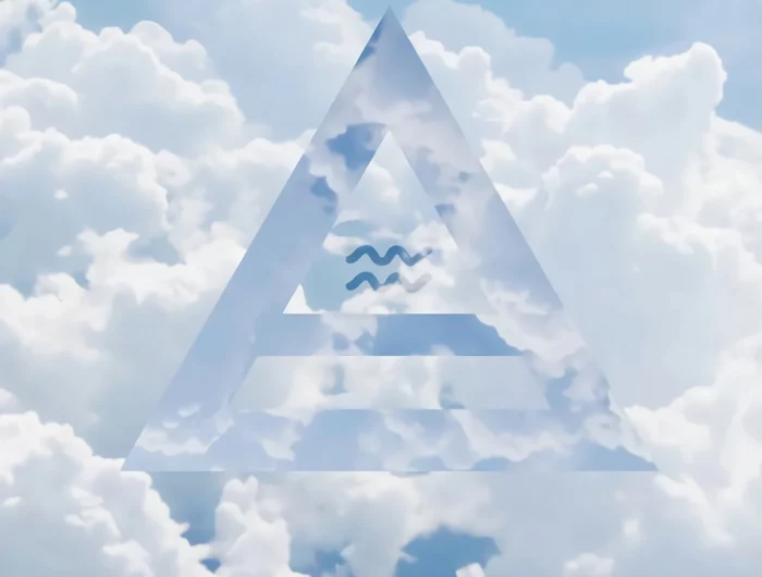 le symbole du signe astrologique du verseau inscrit dans un triangle sur fond le ciel avec des nuages blancs