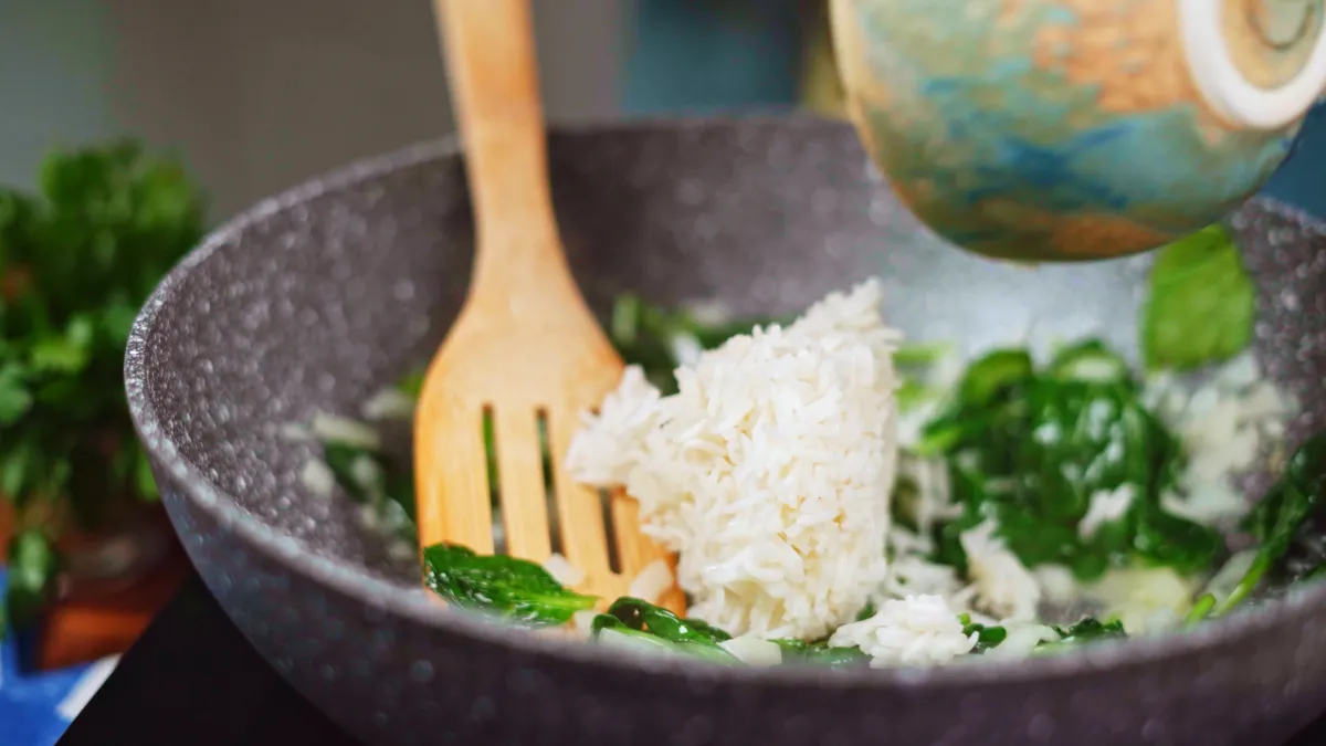 Add the cooked basmati rice to the spinach