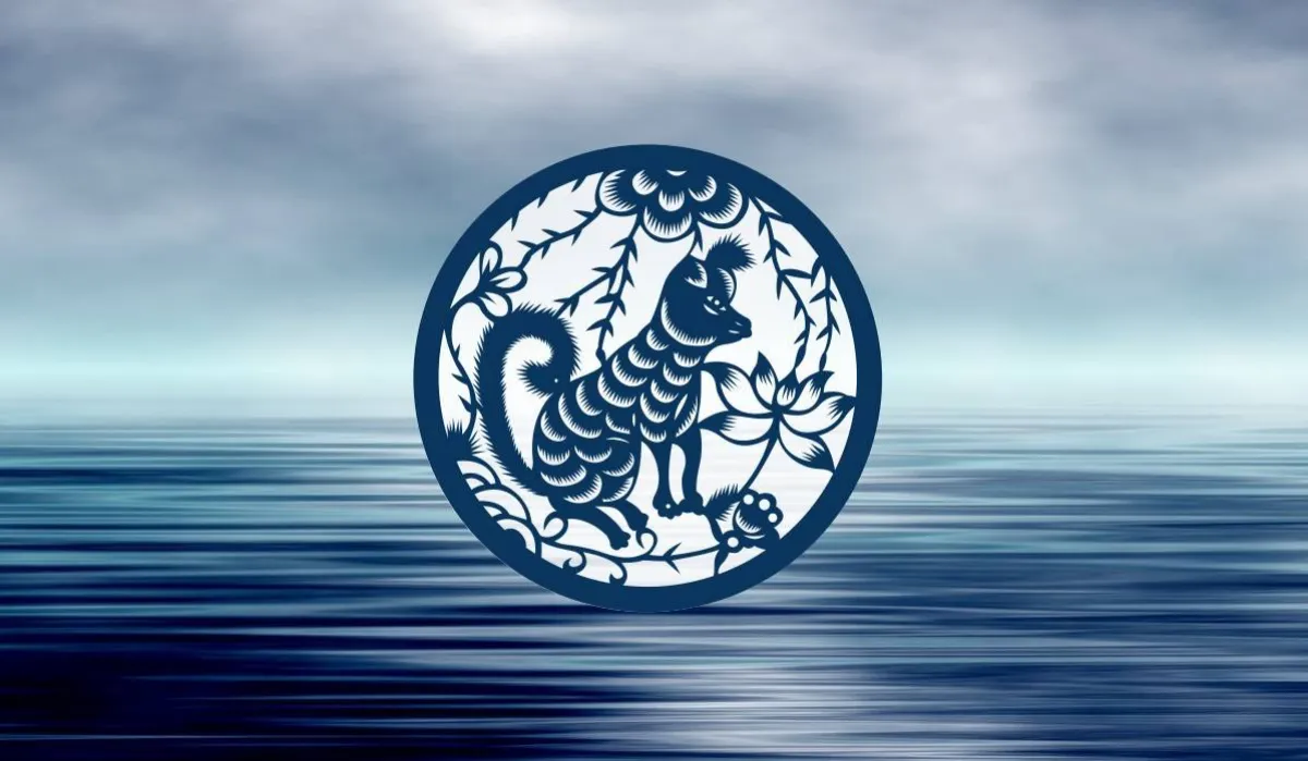 chien d eau du zodiaque chinois avec le symbole dessine dans cercele au desssus de l eau