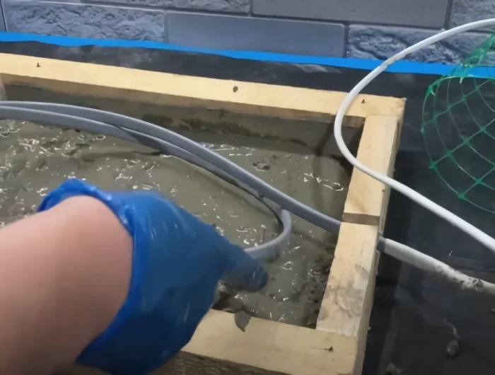 installation du cable chauffant dans la plaque en ciment