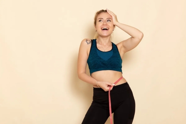 perdre poids ventre graisse abdominale legging vetements sport femme blonde