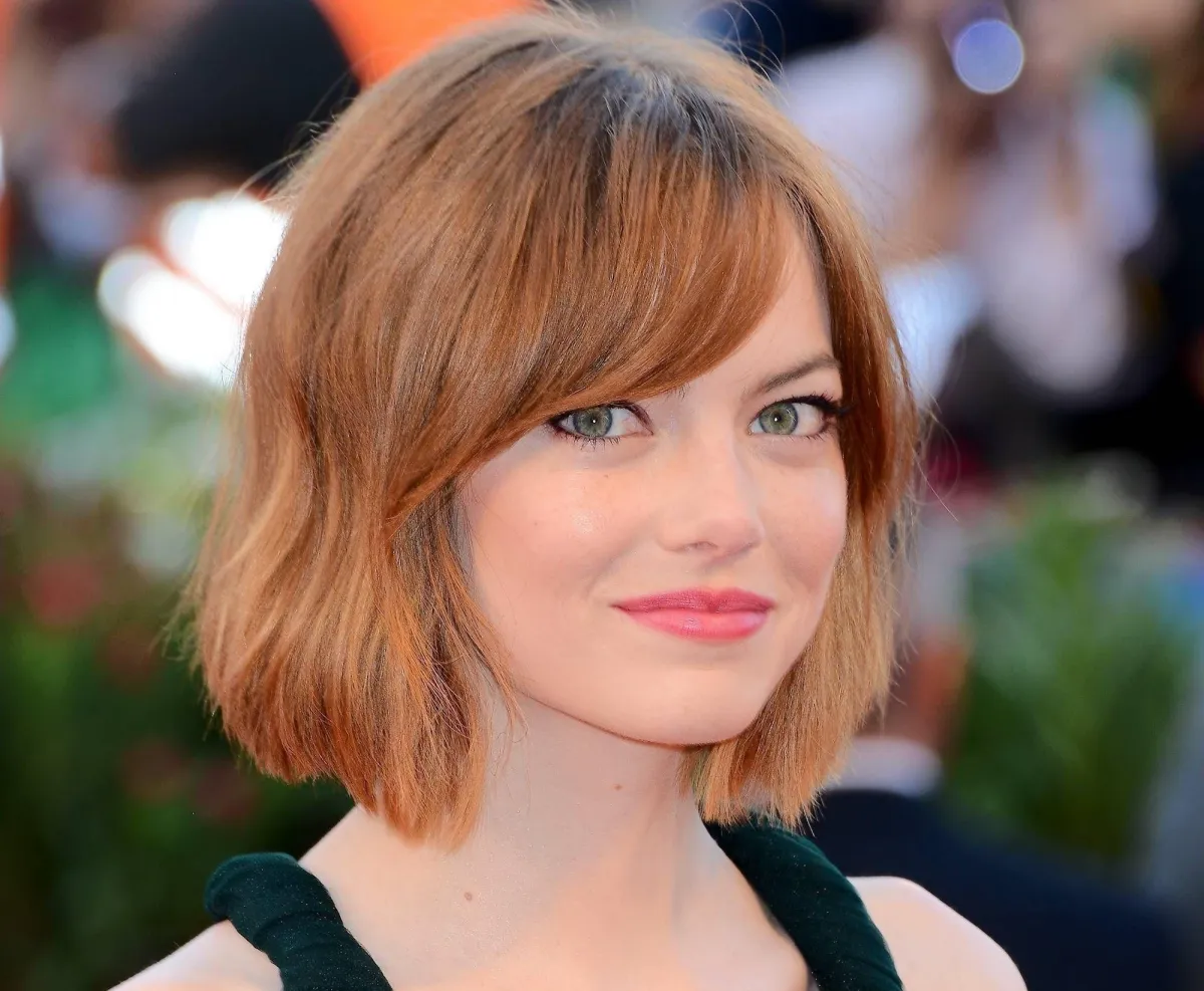 fringe to refine the face emma stone hair color copper rose red