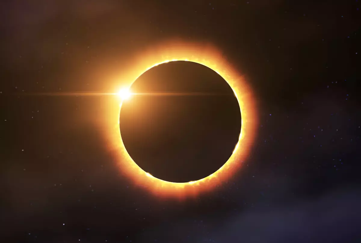 eclipse solaire anneau de feu sur fond noir etoile