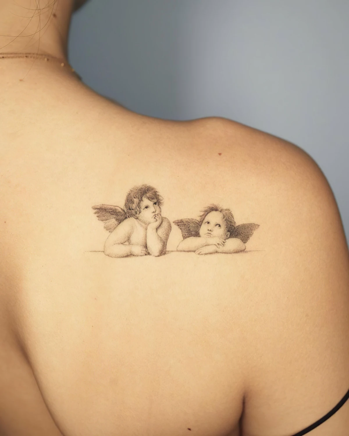 petit tatouage femme deux anges