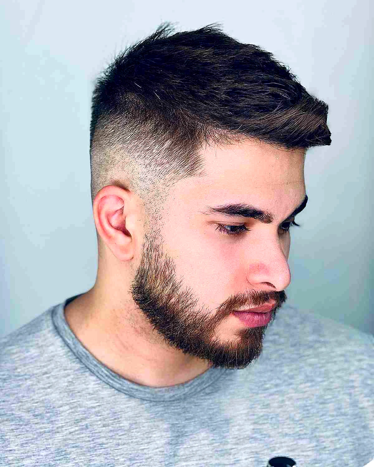 textured top on a taper faded haircut