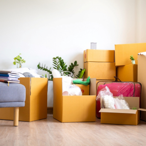 box for personal belongings and furniture. moving boxes in a new house